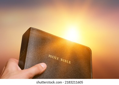 Man hands praying to god with the bible. Believe in goodness. Holding hands in prayer. Power of hope or love and devotion. - Shutterstock ID 2183211605