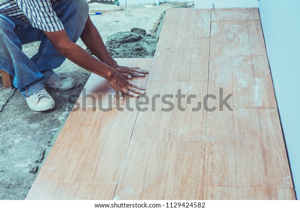 Man Hands Put Ceramic Tile On Stock Photo Edit Now 1129424582