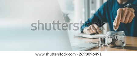 Man hands putting coins stack, Concept business finance saving money and investment.