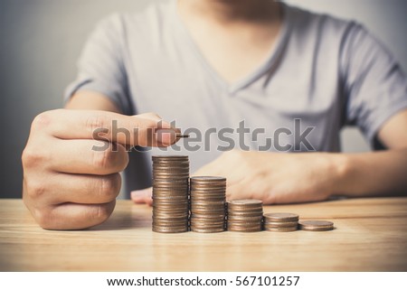 Man hands putting coins stack, Concept business finance save money and investment