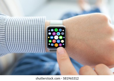 Man hands and smart touch watch with home screen icons apps 