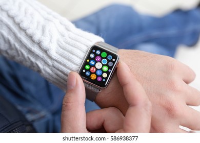 Man hands and smart touch watch with home screen icons apps