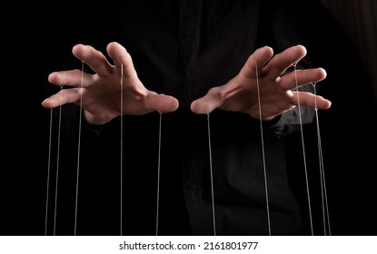 Man hands with strings on fingers. Manipulation, negative influence or addiction concept. Becoming dependent on alcohol, drugs, gambling. High quality photo - Shutterstock ID 2161801977
