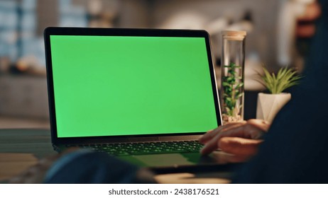 Man hands swiping greenscreen laptop touchpad sitting office closeup. Unknown businessman searching information surfing internet on mockup computer zoom on. Manager working on chroma key pc alone - Powered by Shutterstock