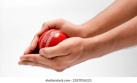 A Man Hands Taking The Catch Of A Red Leather Test Cricket Ball Closeup Picture White Background - Powered by Shutterstock