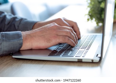 Man hands typing on computer keyboard closeup, businessman or student using laptop at home, online learning, internet marketing, working from home, office workplace freelance concept