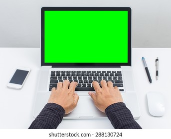 Man Hands Typing On Green Screen Laptop Computer