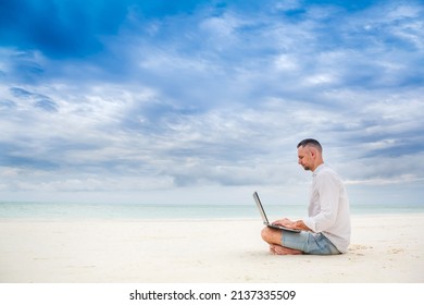 Man hands typing text on laptop computer in front blue sea on thw beach. Concept remote work, freelance. - Powered by Shutterstock