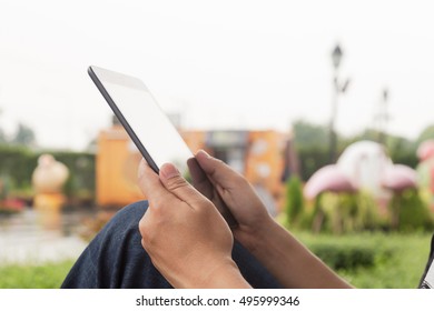 Man hands using digital tablet outdoors , lifestyle, technology background