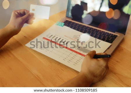 Man hands using tablet, laptop and holding credit card on line shop and Book air ticket (shopping online cradut crad holiday concept)