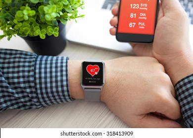 Man Hands With Watch And Phone With App Health On The Screen