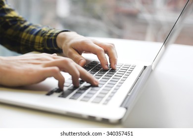 Man hands working on laptop - Shutterstock ID 340357451