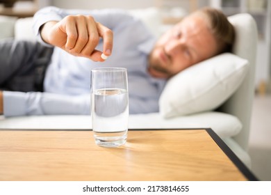 Man With Hangover Taking Medicine Pill Cure