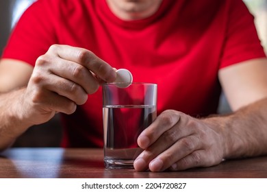 Man With Hangover Taking Medicine Pill Cure. - Shutterstock ID 2204720827