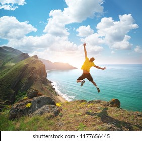 Man happines jump and sea. Emotional scene.