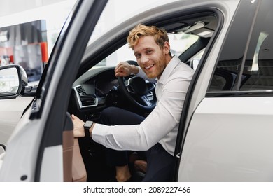 Man happy customer male buyer client in shirt get out car touch door look camera salon drive choose auto want buy new automobile in showroom vehicle dealership store motor show indoor Sales concept - Shutterstock ID 2089227466
