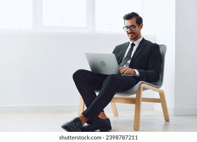 Man happy job technology chair business winner winning businessman office young professional laptop - Powered by Shutterstock