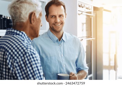 Man, happy and senior father in kitchen with conversation in morning with coffee for bonding in retirement. Proud, dad and son on weekend with together in home for family dinner in the Netherlands. - Powered by Shutterstock