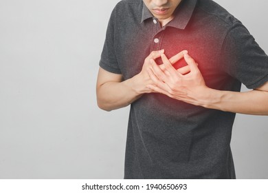 Man has chest pain suffering by heart disease, Cardiovascular disease, heart attack. Health care concept.