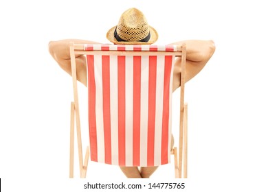 Man With Hat Sitting On A Beach Chair Isolated On White Background