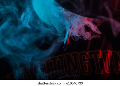 Man with Hat Smoking a Joint in a Cannabis Club