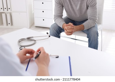 Man Having Appointment With STD Specialist In Clinic, Closeup