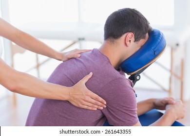 Man Having Back Massage In Medical Office