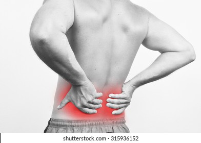 Man having a backache isolated on white