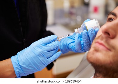 Man Having Botox Treatment At Beauty Clinic