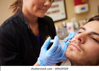 Man Having Botox Treatment At Beauty Clinic