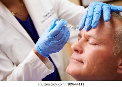 Man Having Botox Treatment At Beauty Clinic