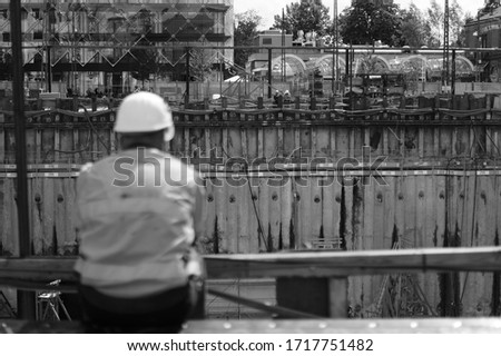 Man having a break from working at constuction site