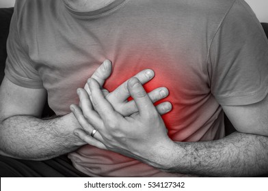 Man having chest pain, heart attack - black and white photo