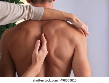 Man Having Chiropractic Back Adjustment Close Up. Osteopathy, Alternative Medicine, Pain Relief Concept