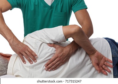 Man having chiropractic back adjustment. Osteopathy, Alternative medicine, pain relief concept. Physiotherapy, sport injury rehabilitation - Powered by Shutterstock