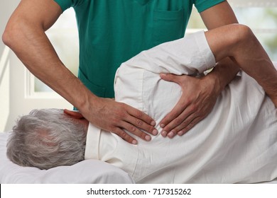 Man having chiropractic back adjustment. Osteopathy, Alternative medicine, pain relief concept. Physiotherapy, sport injury rehabilitation - Powered by Shutterstock