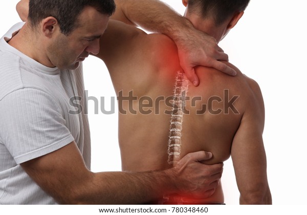 Man having\
chiropractic back adjustment. Osteopathy, Physiotherapy, sport\
injury rehabilitation\
concept
