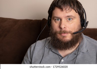 Man Having A Confrence Wearing His Headset While From Home.