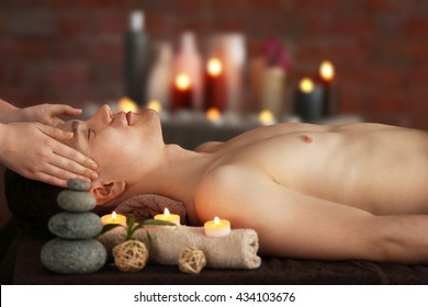 Man Having Facial Massage In Spa Salon