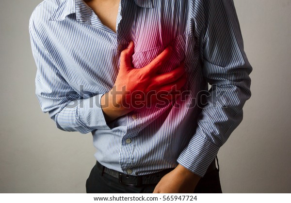 Man Having Heart Ache Holding Hand Stock Photo (Edit Now) 565947724