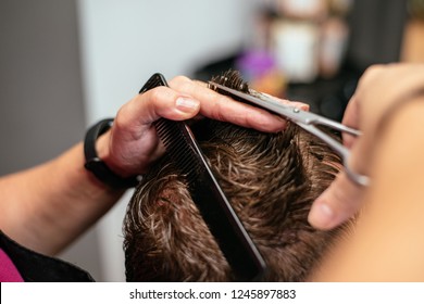 Man Having His Hair Cut In A Barbershop