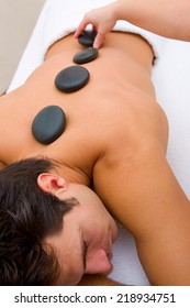 Man Having Hot Stone Massage