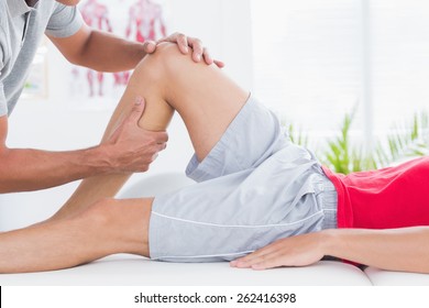 Man Having Leg Massage In Medical Office