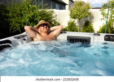 Man having massage in  hot tub Jacuzzi. Spa background.