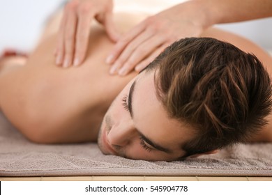 Man Having Massage In Spa Salon