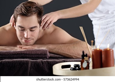 Man Having Massage In Spa Salon