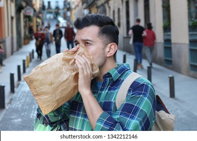 Man Having A Panic Attack In The Crowd