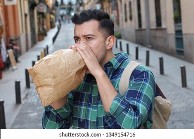 Man Having A Panic Attack In The Crowd