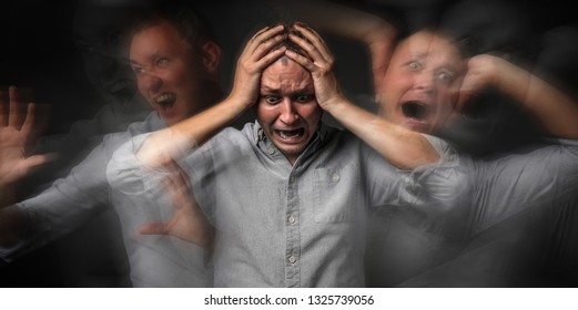 Man Having Panic Attack On Dark Background