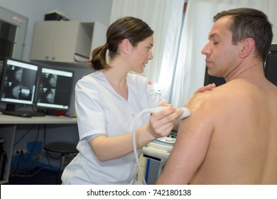 Man Having Ultrasound On The Shoulder